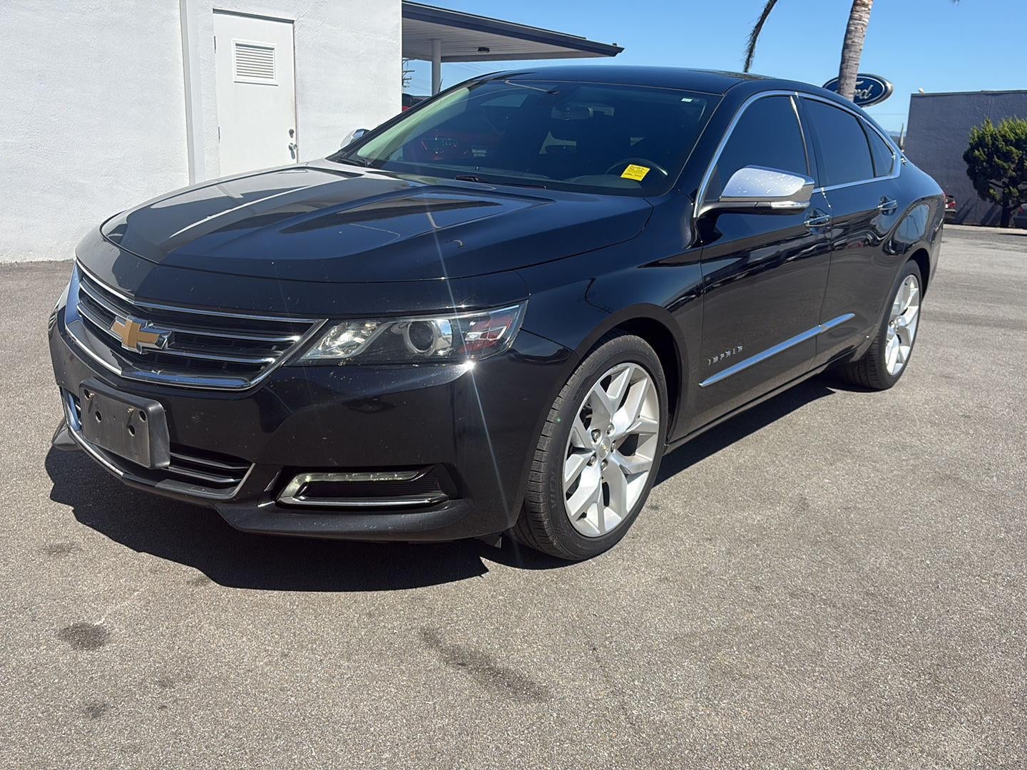 2019 Chevrolet Impala Premier in Black — front three-quarter view