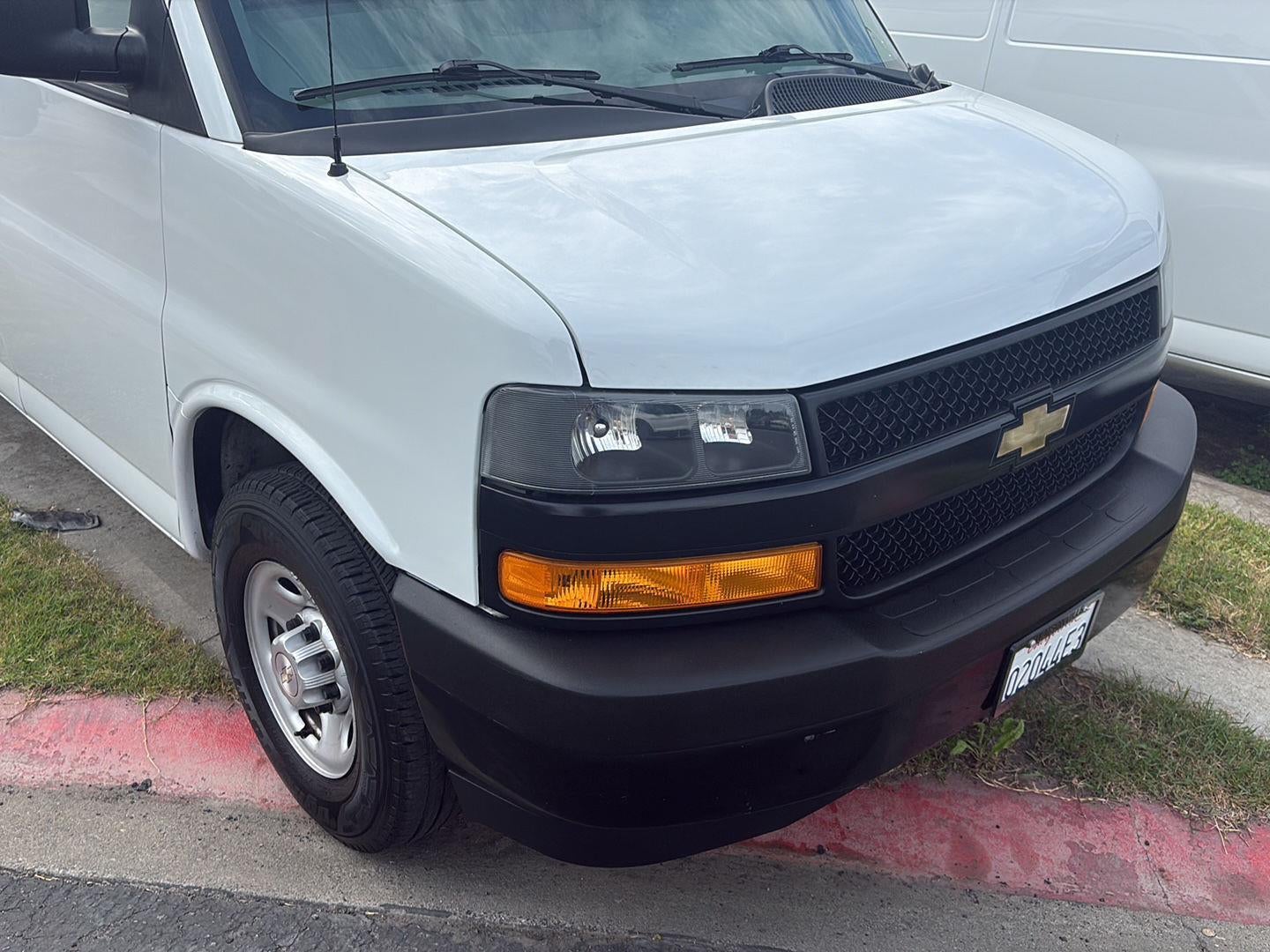 2021 Chevrolet Express Cargo 2500 RWD 2500 Regular Wheelbase WT in Summit White — front three-quarter view