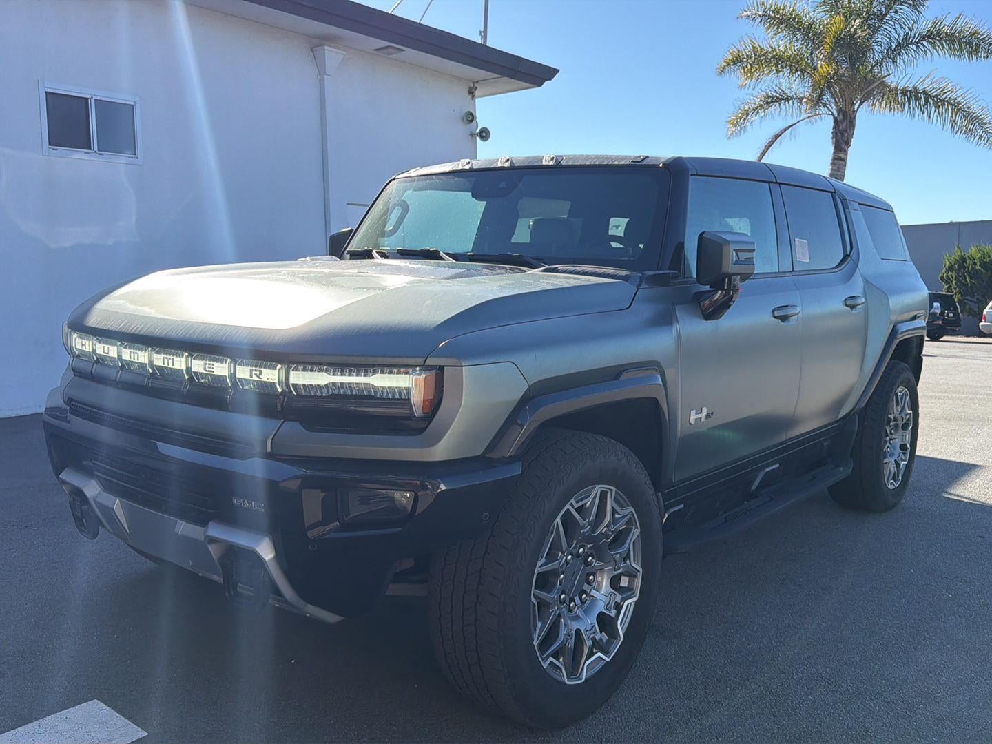 2024 GMC HUMMER EV SUV 3X in Moonshot Green Matte — front three-quarter view
