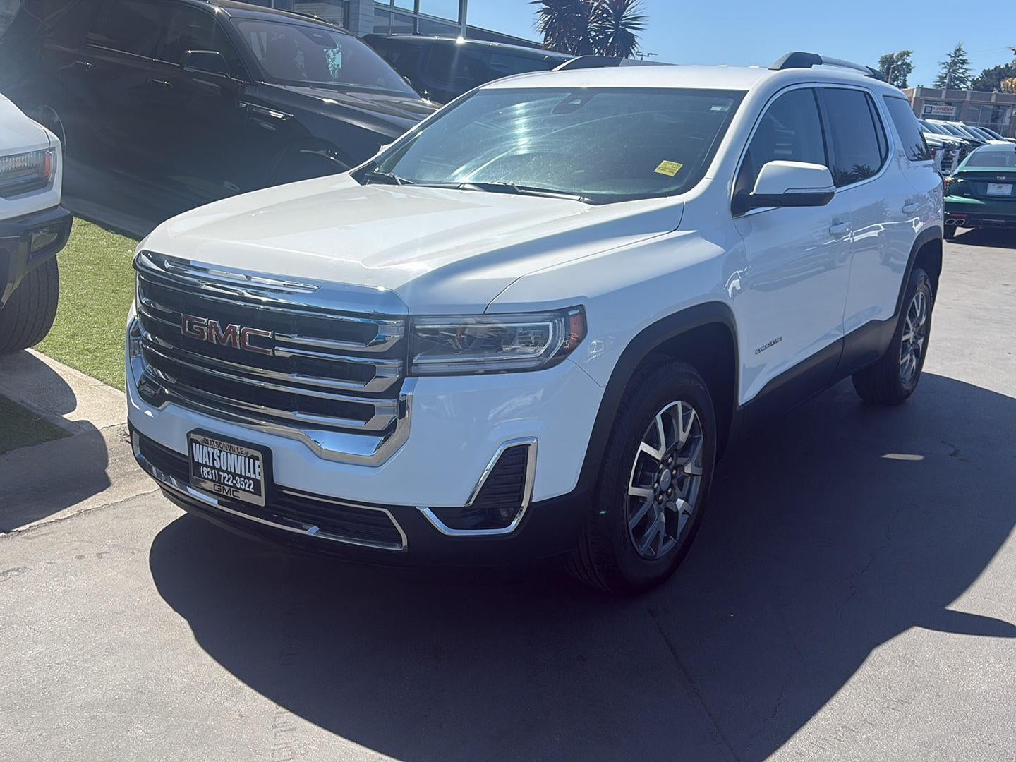 2023 GMC Acadia SLT in Summit White — front three-quarter view