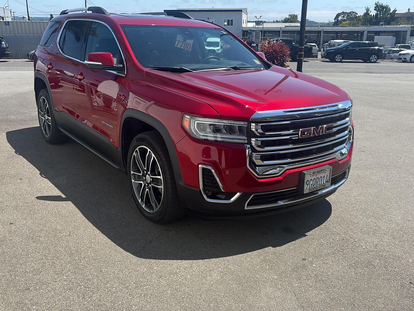 2023 GMC Acadia SLT in Volcanic Red Tintcoat — front three-quarter view