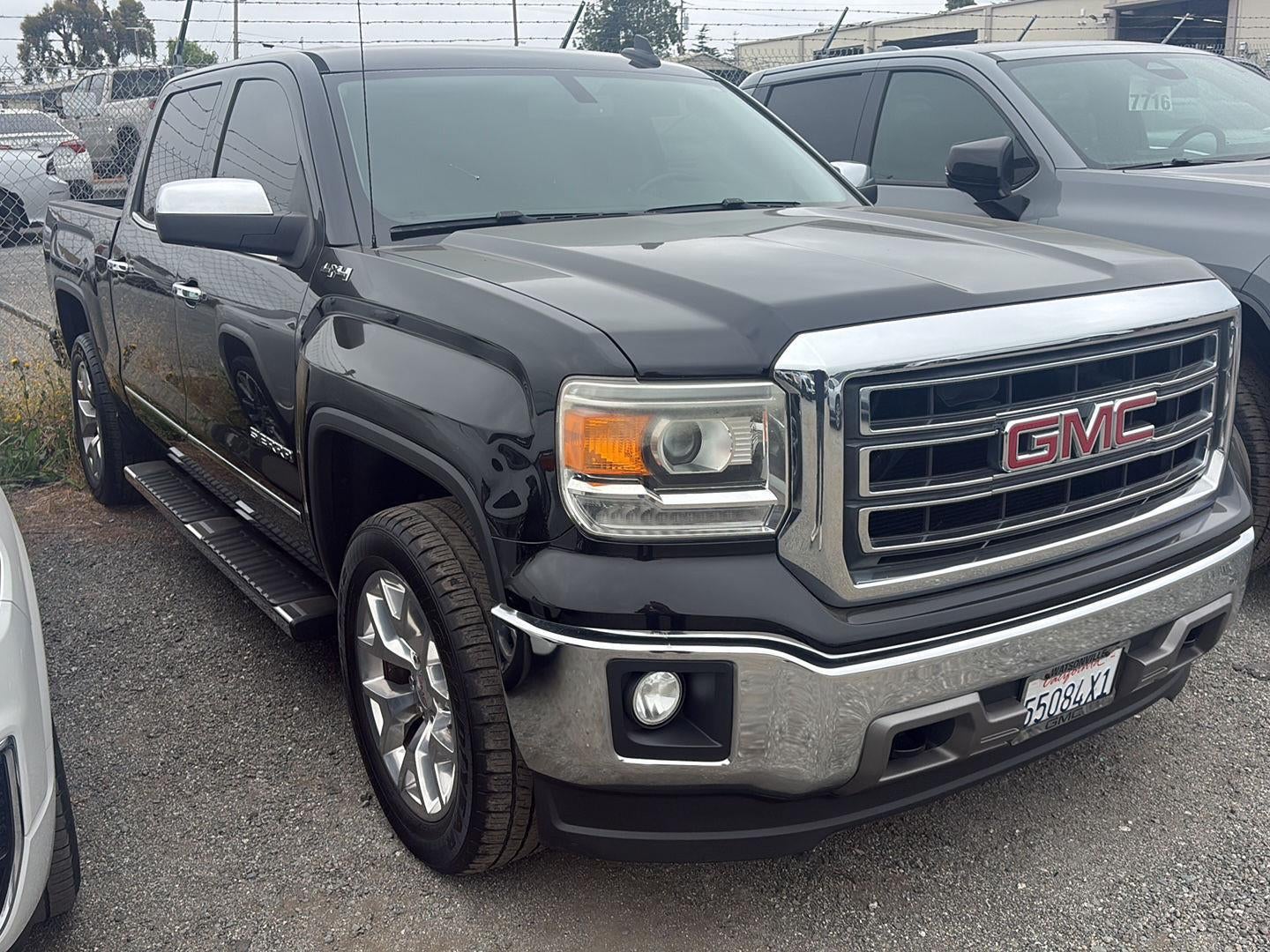 2015 GMC Sierra 1500 SLT in Onyx Black — front three-quarter view