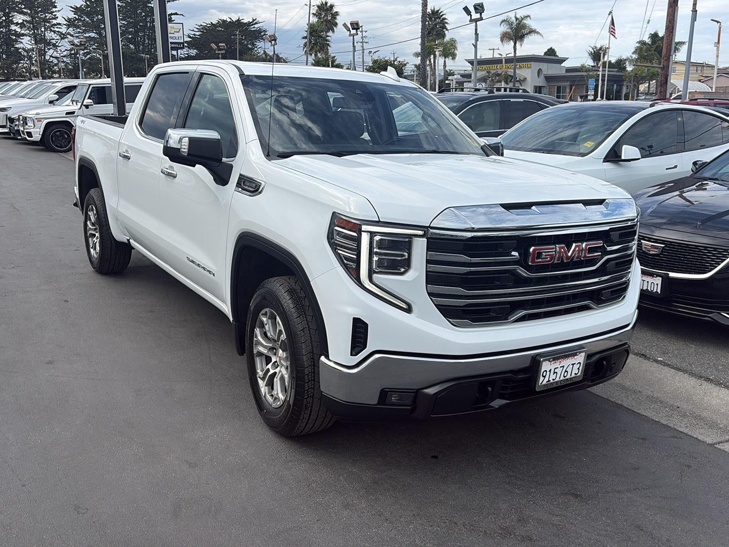 2023 GMC Sierra 1500 SLT in Summit White — front three-quarter view