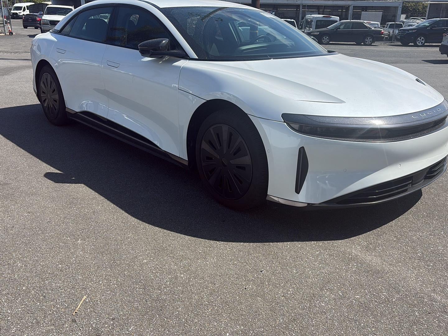 2025 Lucid Air Touring in White — front three-quarter view